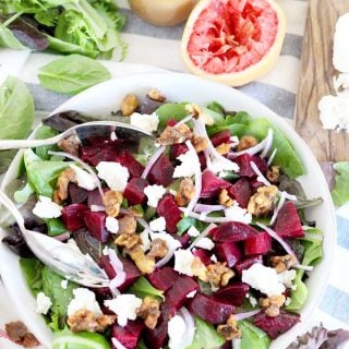 This healthy Roasted Beet Salad with Grapefruit Vinaigrette is the perfect thing to enjoy year round or as a colorful side for the holidays. Packed with goat cheese and candied walnuts, the ingredients combine to make the most perfect salad combination EVER! | www.bowlofdelicious.com
