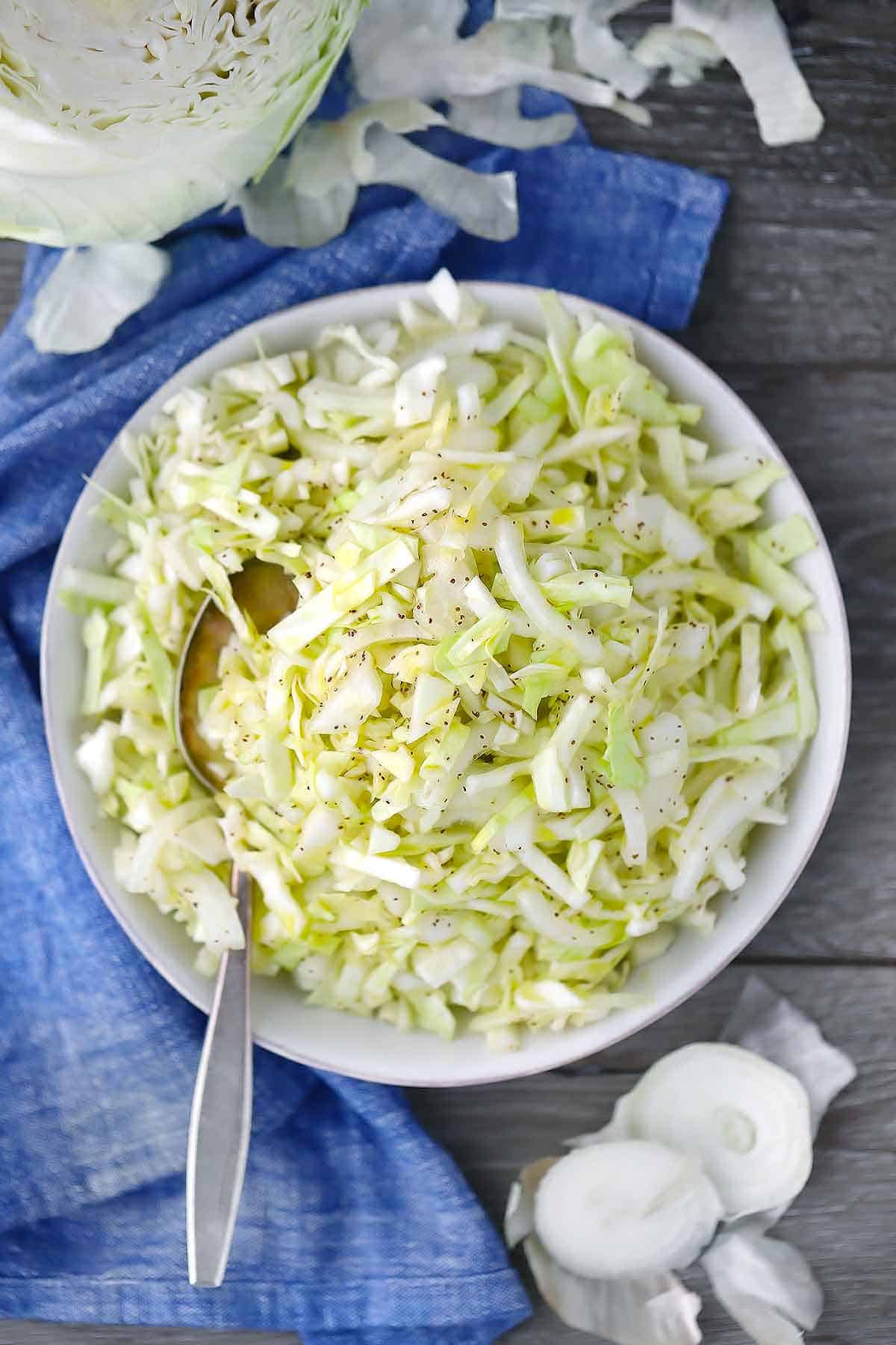Overhead photo of vinegar coleslaw with no mayo and a spoon.