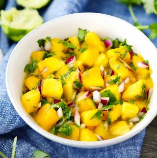 A white bowl with Mango Salsa in it.