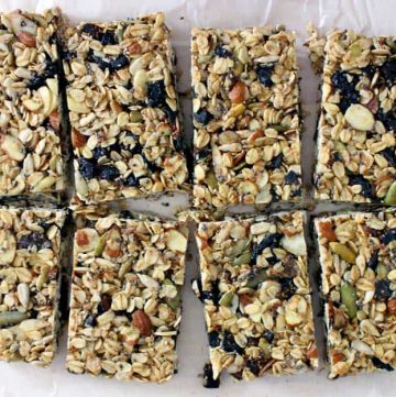 Bird's eye view of a sheet of granola bars that has been cut into eighths.