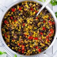 Square photo of black beans in a large skillet.