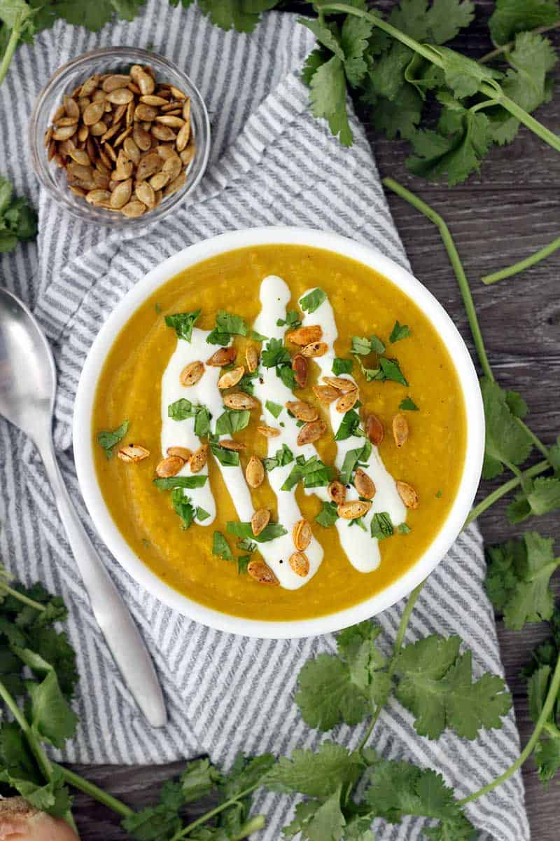 This slow cooker butternut squash soup is packed with flavor from curry, ginger, and other spices like turmeric. It's vegan, super creamy, and paleo/whole30 compliant!