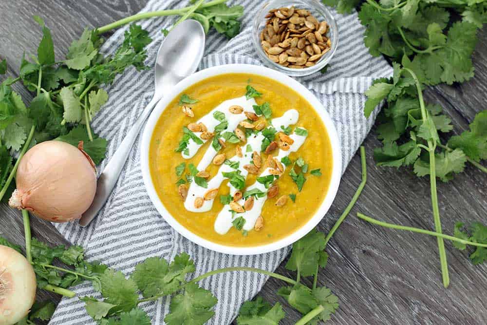 This slow cooker butternut squash soup is packed with flavor from curry, ginger, and other spices like turmeric. It's vegan, super creamy, and paleo/whole30 compliant!