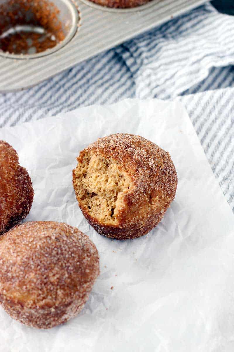 Whole Wheat Apple Cider Donut Muffins are melt-in-your-mouth, fluffy, and cake-like. They're partially sweetened with reduced apple cider, and brushed with melted butter and rolled in cinnamon and sugar after baking.