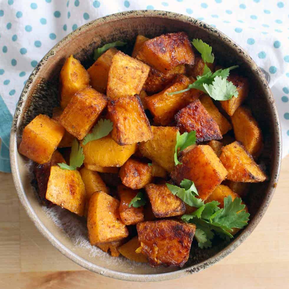 Bird's eye view of a bowl of cubed, roasted butternut squash