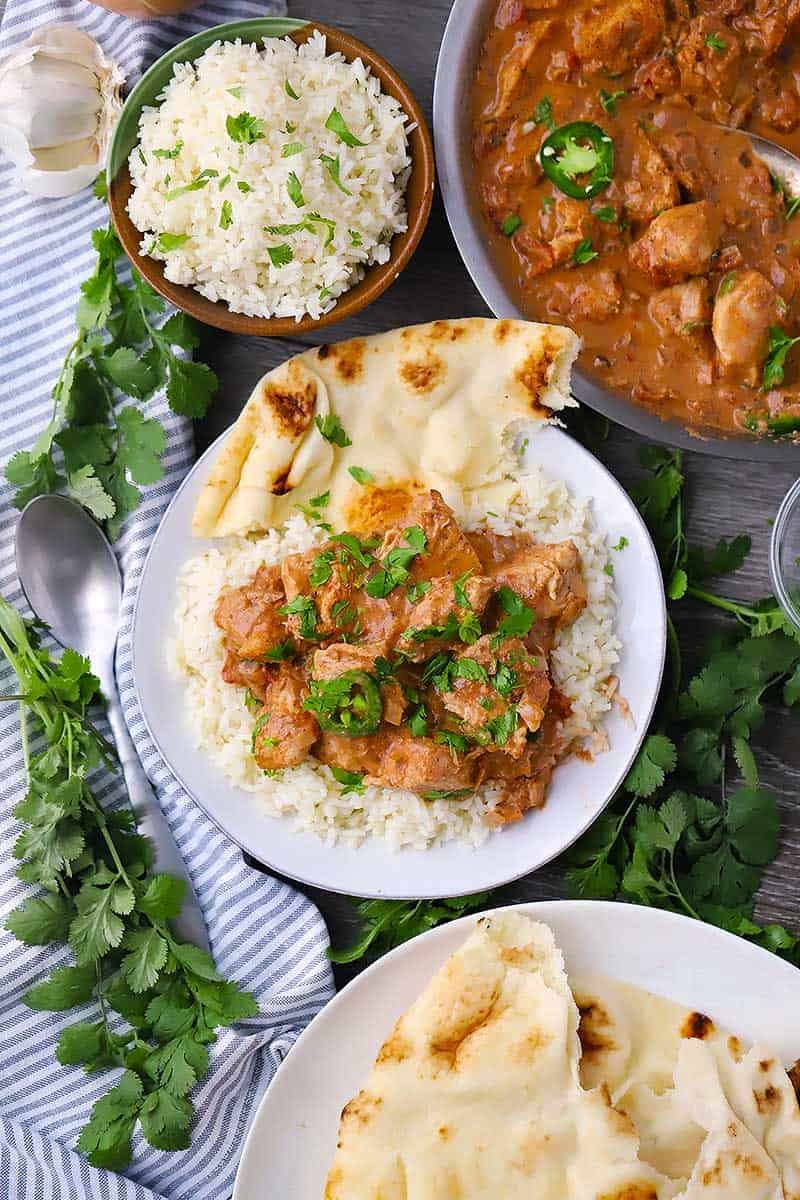 Overhead photo of a plate of chicken tikka masala and rice.