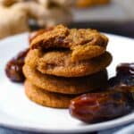 Square photo of a stack of fresh ginger and date cookies.