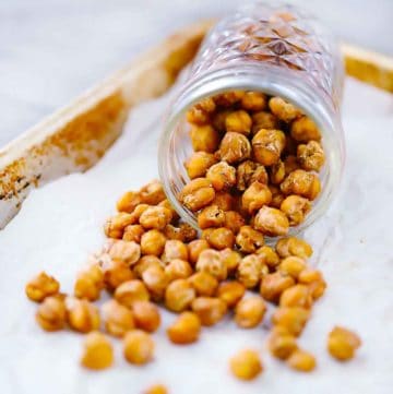 Square image of roasted chickpeas in a mason jar.
