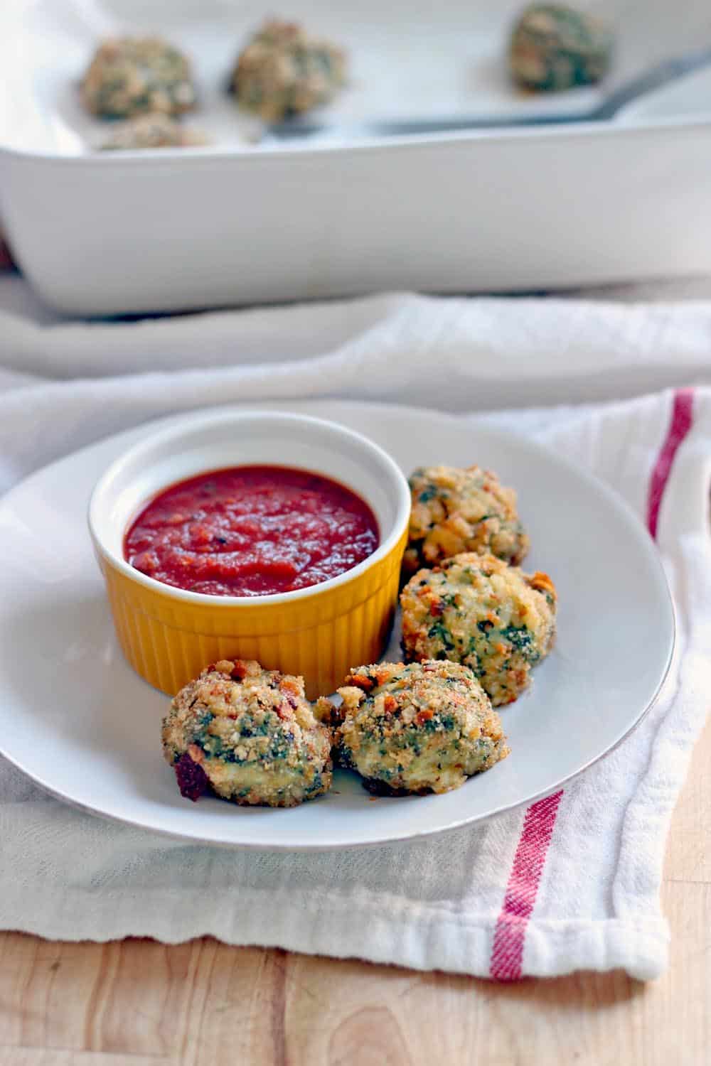These Oven-Baked Spinach and Barley Arancini are kid friendly, healthy, delicious, and super easy to make! Plus, you can freeze them for later. If you're looking for a healthy alternative to frozen chicken nuggets, this is it!