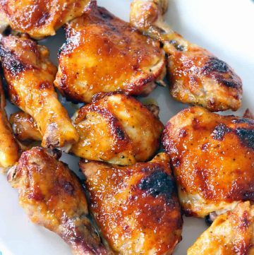 A platter of oven bbq chicken thighs and drumsticks