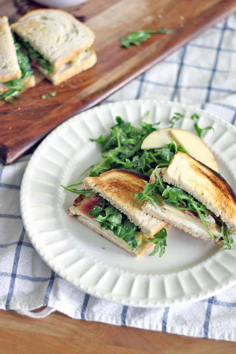 Apple and Prosciutto Sandwich with Goat Cheese and Arugula | This sandwich is the PERFECT combination of sweet, salty, tangy, and peppery. It takes 5 minutes to make and it's light and healthy, but will leave you feeling full and satisfied!