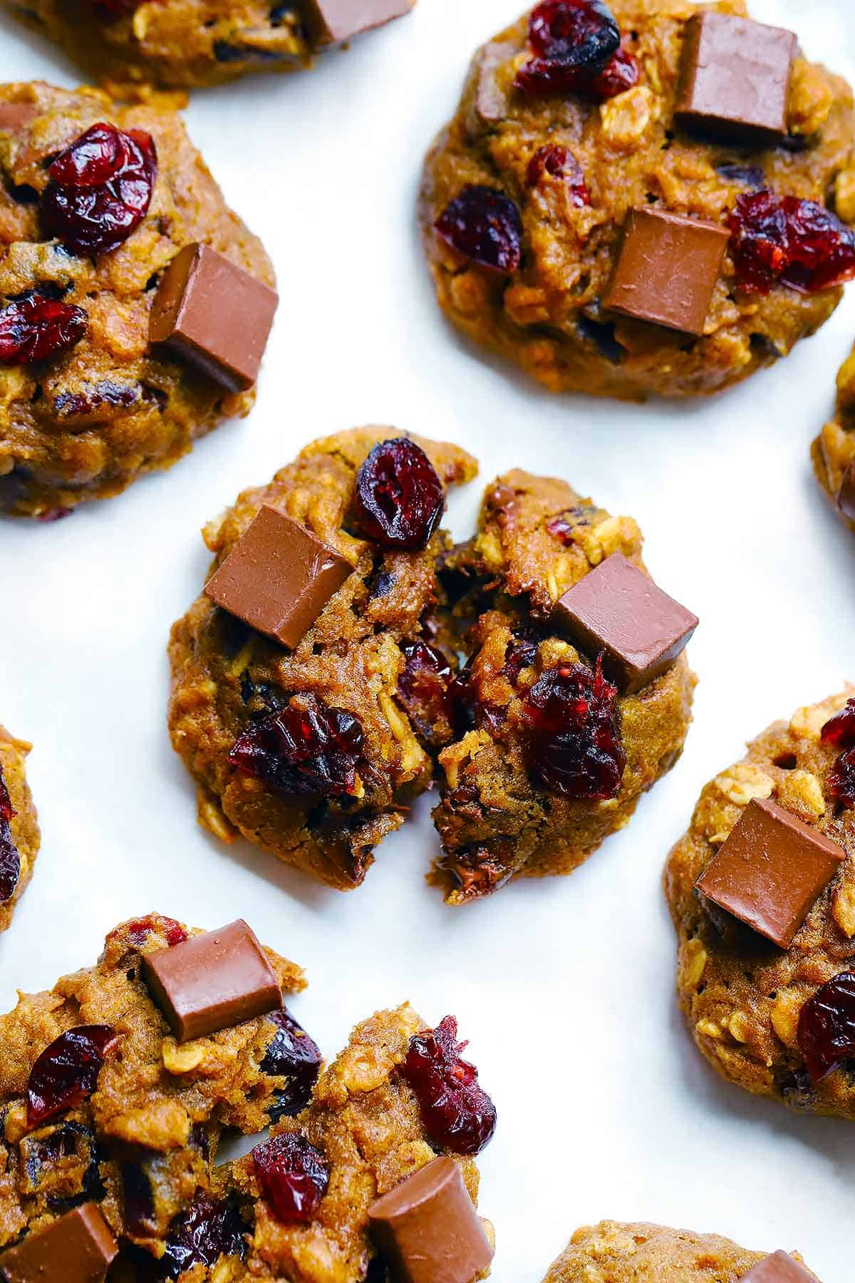 Overhead photo of pumpkin chocolate cranberry oatmeal cookies.