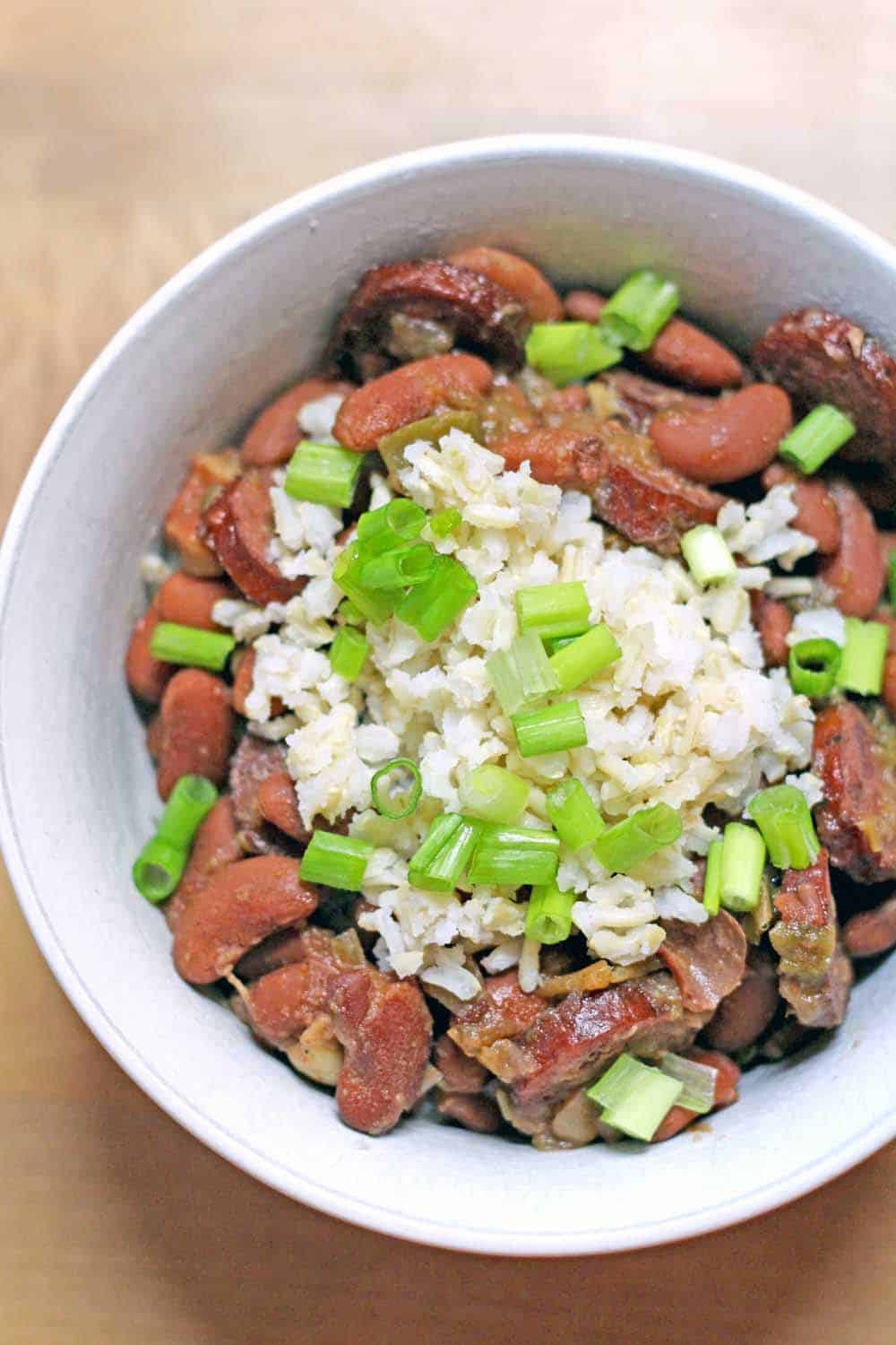 Perfectly creamy, smoky, and savory, these slow cooked red beans taste just like you'd find in New Orleans and are inexpensive and easy to make!