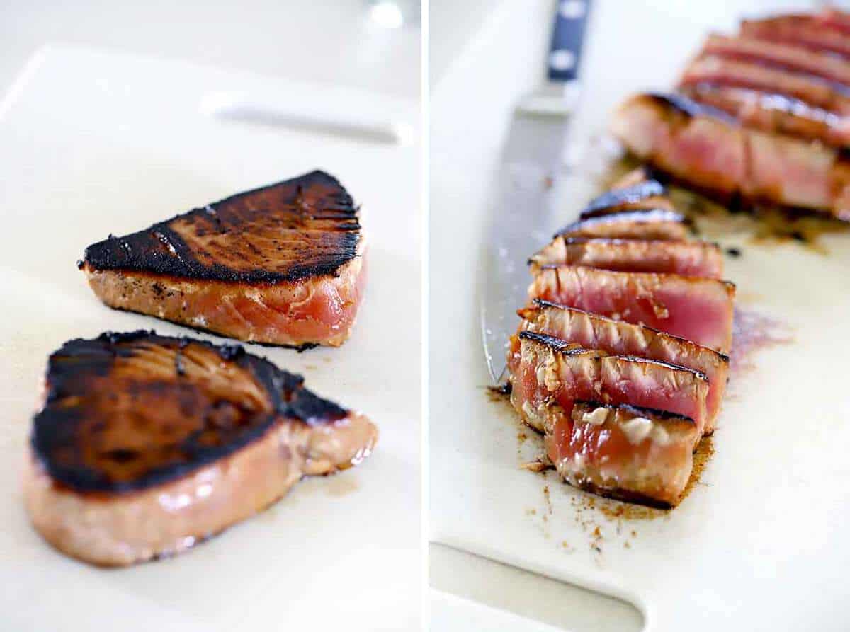 Ahi tuna steaks cut into slices on a cutting board