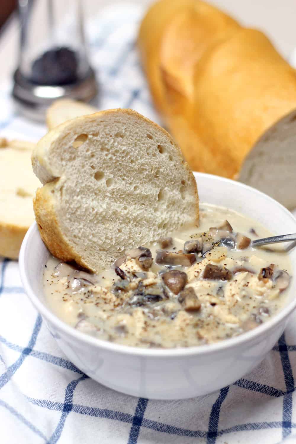 This creamy mushroom, chicken, and wild rice soup is creamy, hearty, easy to make, and super fast if you pre-cook the chicken and rice! Make a ton and freeze it for later.