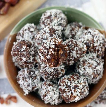 These Whole30 / Paleo chocolate coconut energy balls are an amazing midday snack and energy boost! Sweetened only with dates and super easy to make, they taste decadent, similar to an almond joy, but are 100% guilt-free.