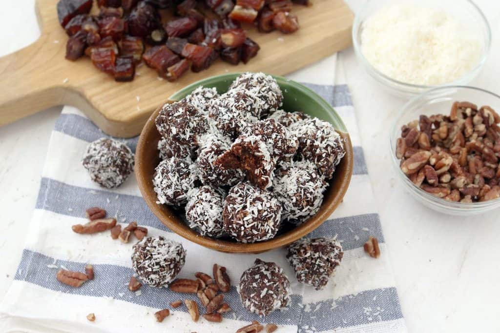 These Whole30 / Paleo chocolate coconut energy balls are an amazing midday snack and energy boost! Sweetened only with dates and super easy to make, they taste decadent, similar to an almond joy, but are 100% guilt-free.