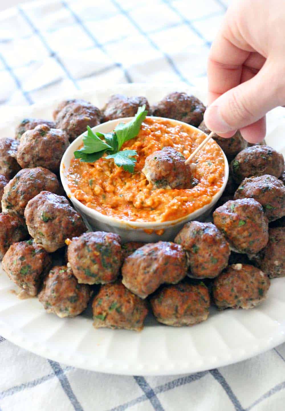 This Paleo/Whole30 baked version of Greek Meatballs (Keftedes) are paired with a super easy Romesco Sauce. The PERFECT make-ahead appetizer for your next party!