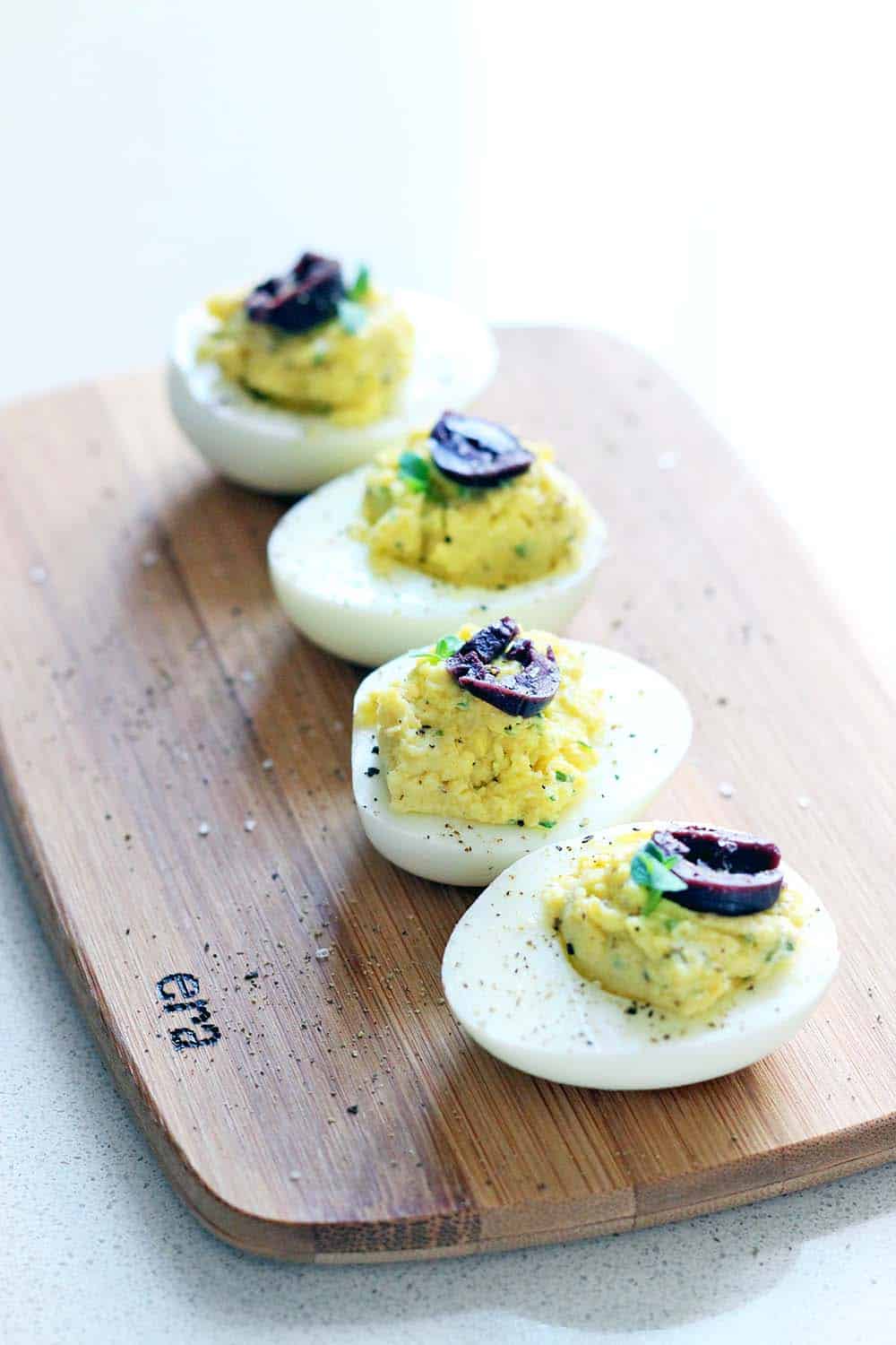 Olive oil and red wine vinegar are used in place of mayo and mustard with fresh oregano in this Greek Deviled Egg recipe. Paleo and Whole30 compliant!