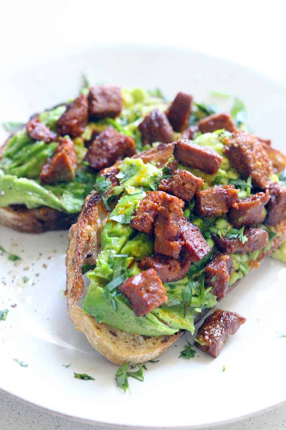 AVOCADO TOAST IS AMAZING!!! This version has spicy and smoky chorizo on top, and is seasoned with fresh lime juice, garlic, and cilantro. Good for breakfast, lunch, or dinner, and only takes FIVE MINUTES to make!