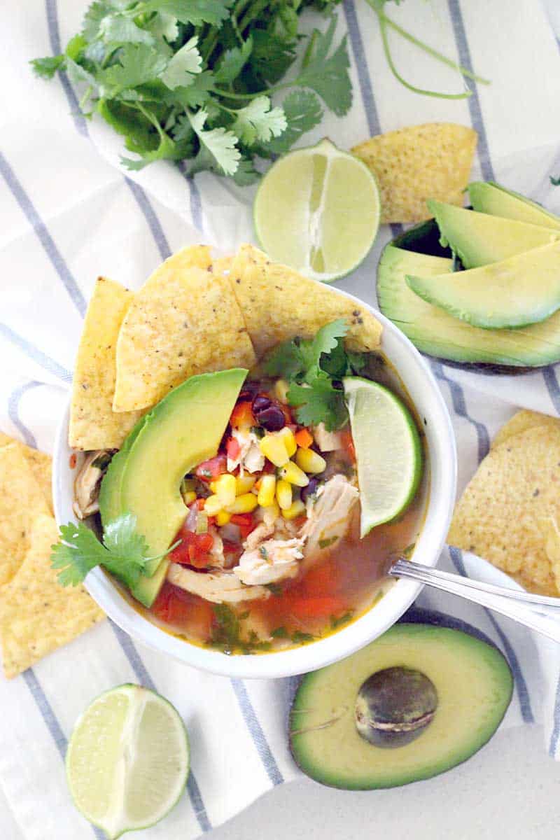 Healthy, easy, and DELICIOUS- this one pot chicken tortilla soup has a spicy kick and tastes super fresh. Make a double batch and freeze one!