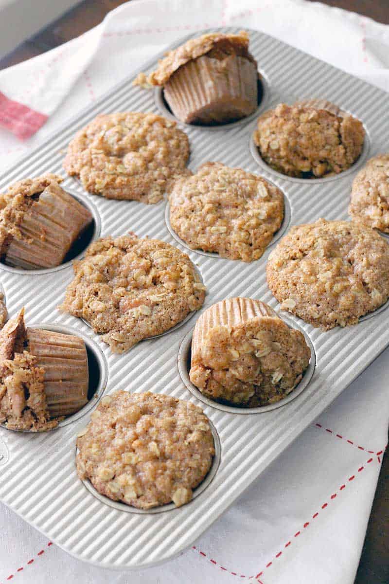 Packed with fresh apples, cinnamon, maple syrup, yogurt, oats, whole wheat flour, and a bit of brown sugar, these muffins are healthy and taste and smell AMAZING- just like fall!