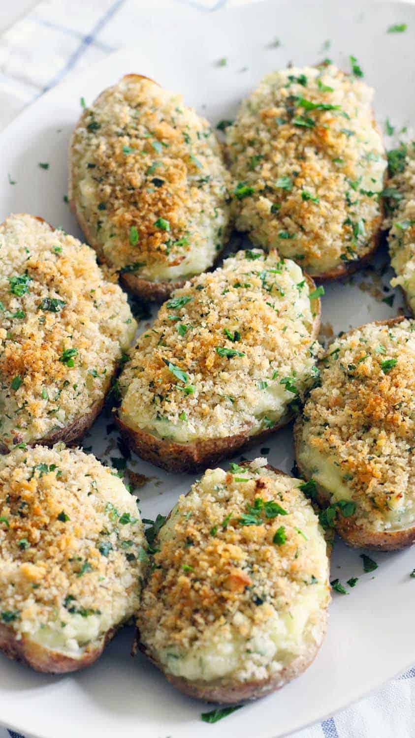Creamy on the inside, crunchy breadcrumb topping on the outside- these are the BEST twice baked potatoes EVER! Perfect for Thanksgiving or any Holiday meal. Plus, they're freezable if you assemble ahead of time or have leftovers. Sponsored by @IdahoPotatoes. This is my late grandfather's famous recipe, and I can't remember a holiday meal without them!
