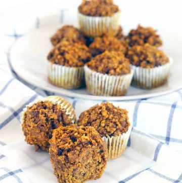 These Gluten Free Pumpkin Oat Muffins are packed with healthy ingredients like oats, pumpkin, and walnuts. They're more like a delicious energy bar than a muffin, and are the perfect hearty grab and go breakfast.