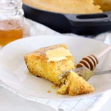 This honey skillet cornbread is a Southern classic- slightly sweet, moist, and with caramelized edges from the cast iron skillet. It's the ONLY way to cook cornbread!