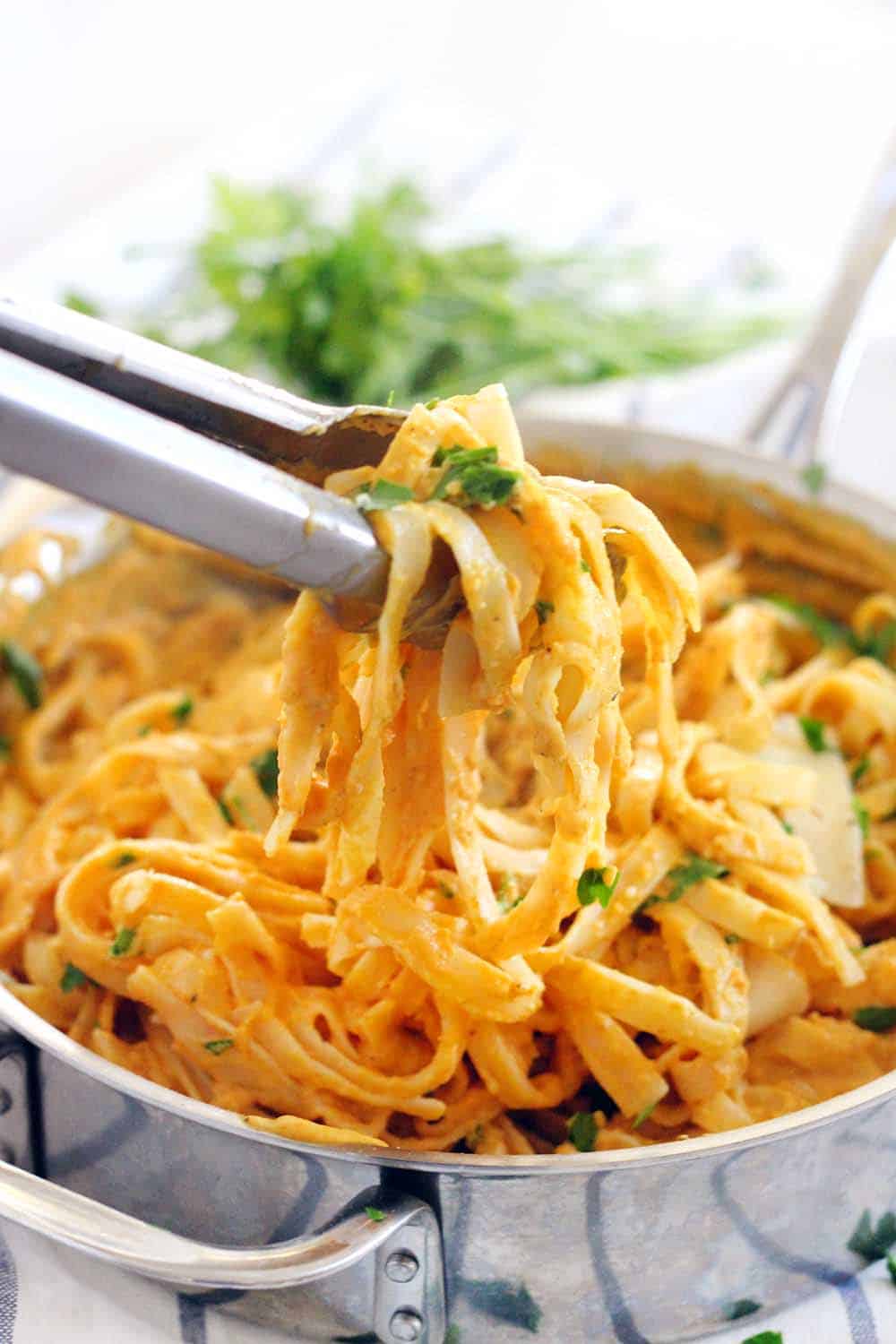 With 60% fewer calories than traditional Alfredo sauce, this Pumpkin Fettucini Alfredo is healthy, creamy, and delicious. It's a great way to sneak veggies into a main course, especially in the fall season!