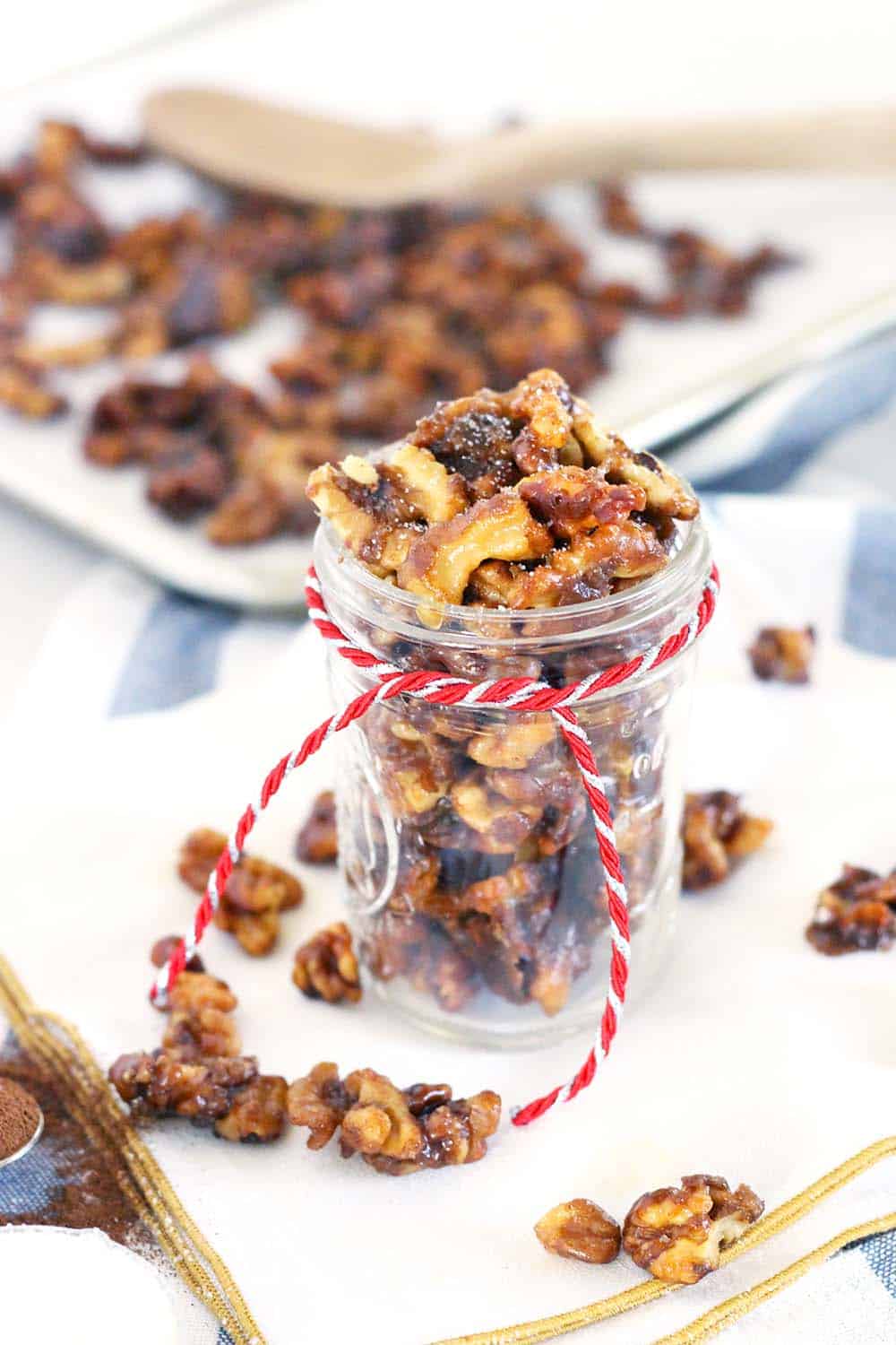 This candied walnut recipe takes only 5 minutes and 5 ingredients! Eat as a sweet treat, toss with a salad, or serve on a cheese board. Perfect as a holiday gift packaged in mason jars. | www.bowlofdelicious.com