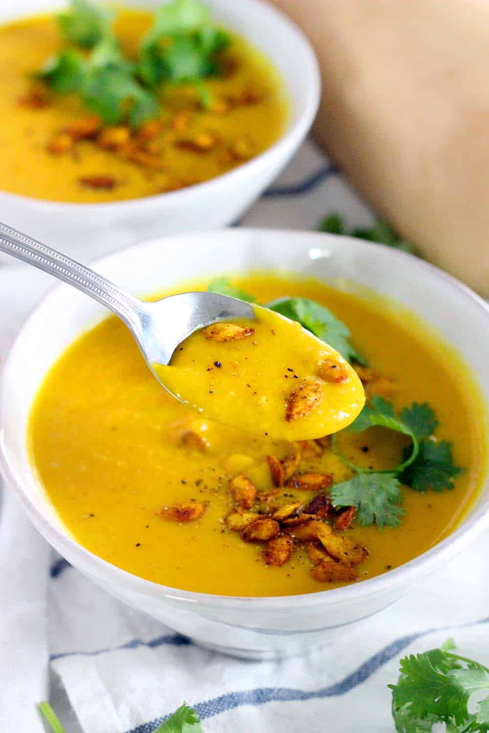 This Ginger Turmeric Butternut Squash Soup is full of healing, healthy ingredients. It's warm, deliciously bright, vegan, low carb, Paleo, and Whole30 compliant!