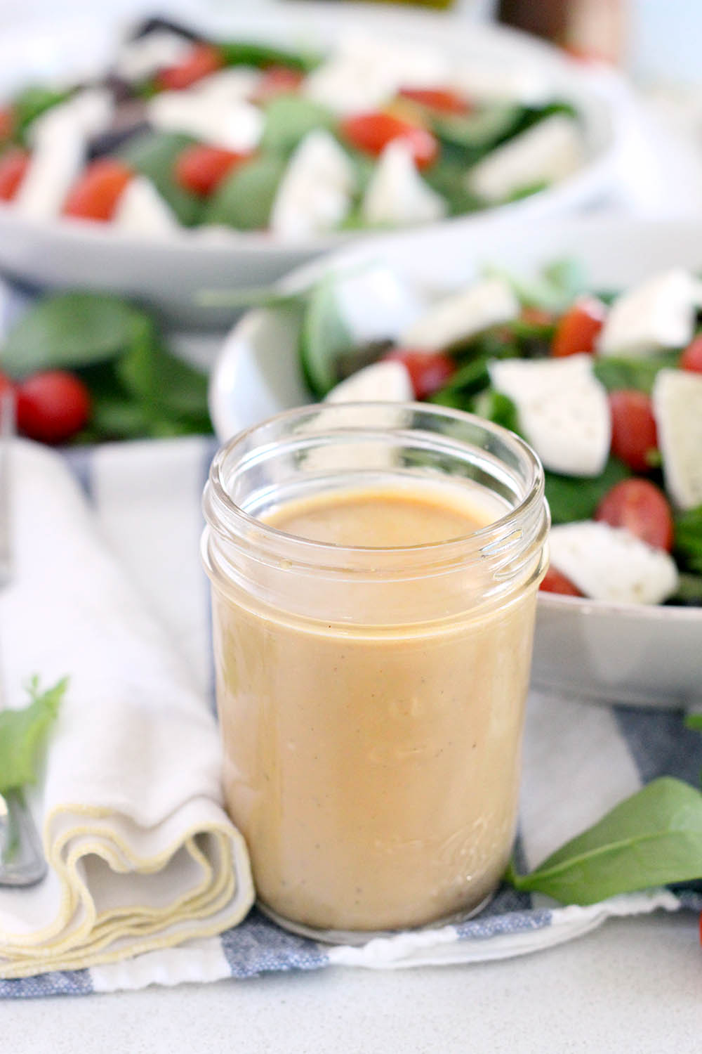 This Creamy Maple Balsamic Dressing is tangy, slightly sweet, and perfectly creamy. It's my new favorite salad dressing recipe! Toss with mixed greens, or drizzle on a Caprese salad. 