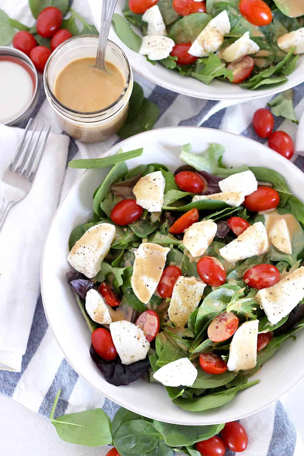 This Creamy Maple Balsamic Dressing is tangy, slightly sweet, and perfectly creamy. It's my new favorite salad dressing recipe! Toss with mixed greens, or drizzle on a Caprese salad. 