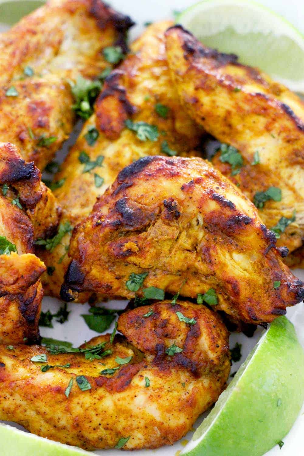 This Oven Broiled Tandoori Chicken is super flavorful, charred, and smoky- just like at your favorite Indian restaurant! This healthy, low carb recipe takes only 20 minutes to cook and is perfect on its own or in your favorite Indian chicken dish.