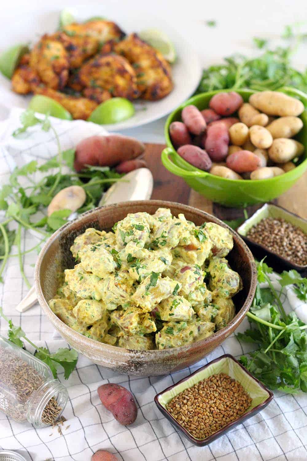 This Nepalese Potato Salad, or Chukauni, is a yogurt-based potato salad. It's gluten-free, healthy, and creamy, and it's packed full of delicious spices such as fenugreek, turmeric, cumin, cilantro, and cayenne. From Raghavan Iyer's Smashed, Mashed, Boiled, and Baked cookbook.