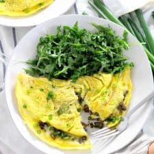 These Mushroom and Cheddar Omelettes are the perfect low-carb, healthy, fast meal to make any time of the day! This vegetarian recipe takes only ten minutes to throw together.
