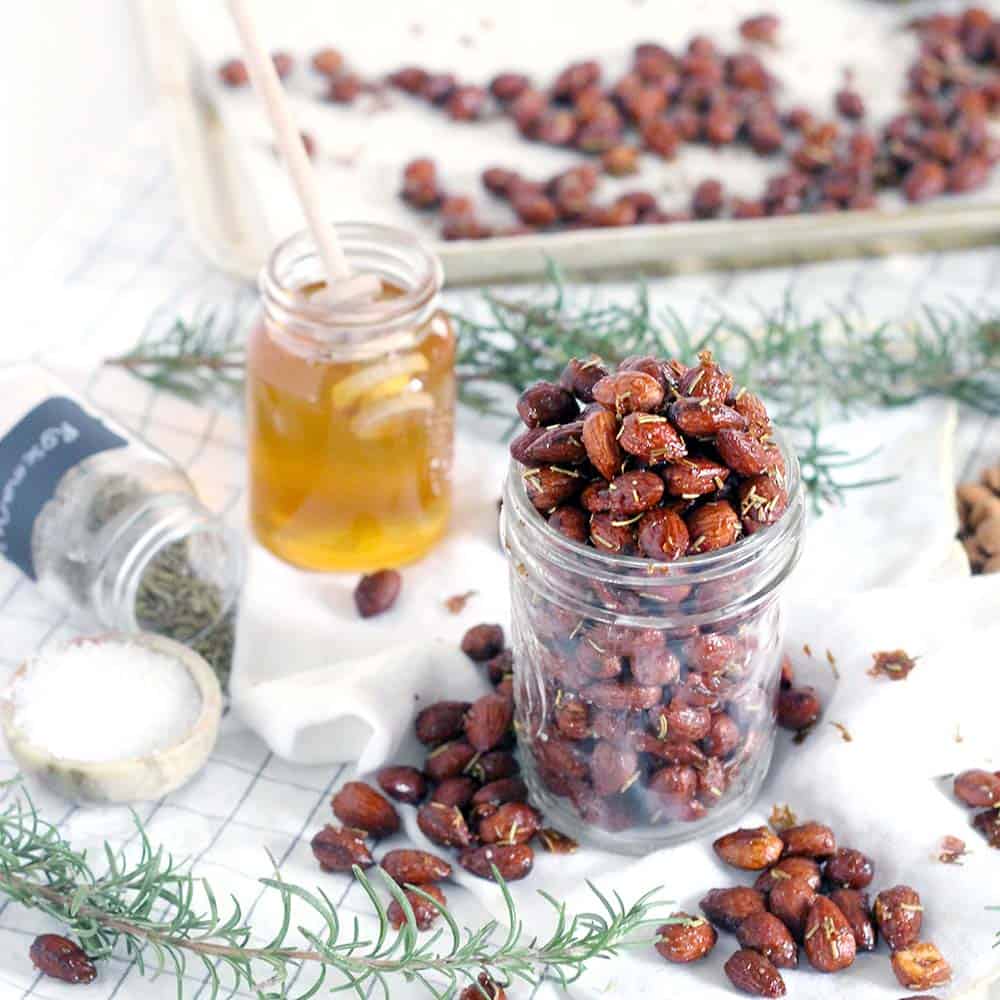 These Rosemary and Honey Roasted Almonds are my new favorite snack recipe- savory, sweet, and nutritious for a guilt-free midday treat! Plus, they're a cinch to make.