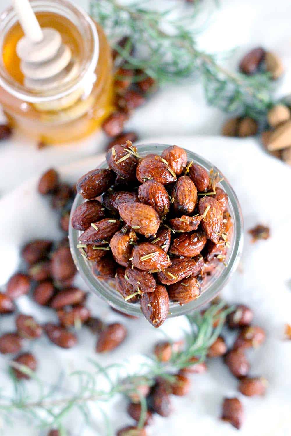 These Rosemary and Honey Roasted Almonds are my new favorite snack recipe- savory, sweet, and nutritious for a guilt-free midday treat! Plus, they're a cinch to make.