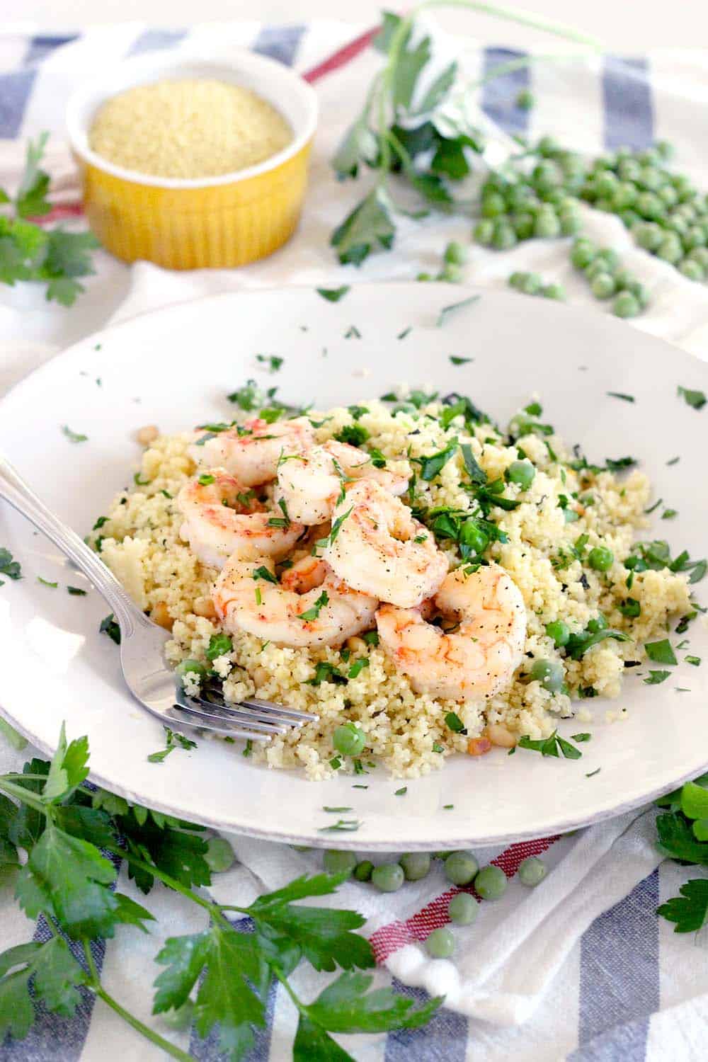 This Shrimp and Couscous with Peas and Mint recipe is a simple, healthy, 20 minute meal that's a cinch to make and perfect for spring!