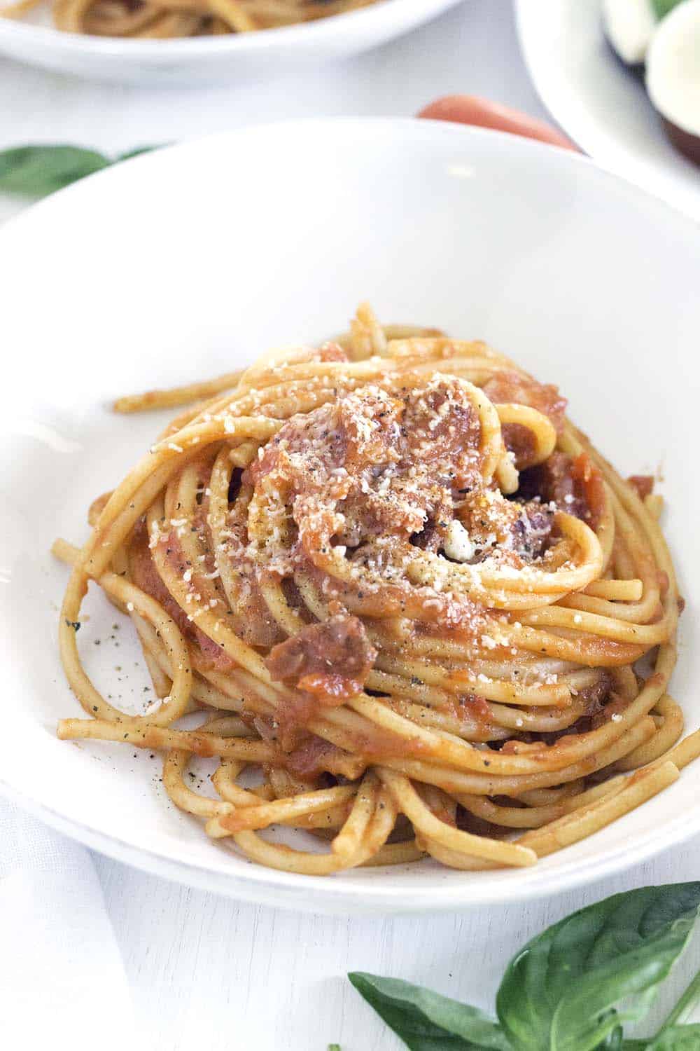 This Bucatini all'Amatriciana recipe is the real deal- authentically made with NO garlic- just a simple tomato sauce and the highest quality ingredients. You can make this amazing Italian pasta from scratch in only 30 minutes!
