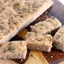 This whole wheat no knead focaccia with rosemary and sea salt is so delicious and easy to make, you'll never need to go to the bakery again!