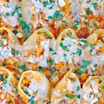 These buffalo chicken stuffed shells are packed with buttery hot sauce and shredded chicken, blue and pepper jack cheeses, and crunchy celery. A decadent make ahead meal for people that LOVE buffalo chicken!