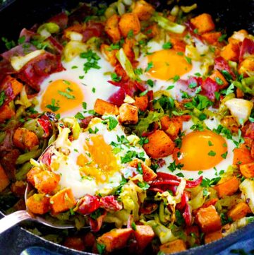 This four ingredient Sweet Potato, Corned Beef, and Cabbage Breakfast Bake is low-carb, gluten-free, and paleo friendly! Start your day with this delicious, nutrient-packed recipe.