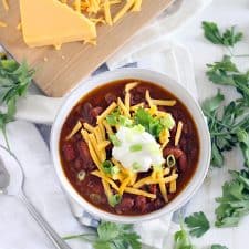 This Instant Pot Chili is made with ground beef and dry kidney beans, and comes together in less than an hour! It's cheap, healthy, and DELICIOUS.