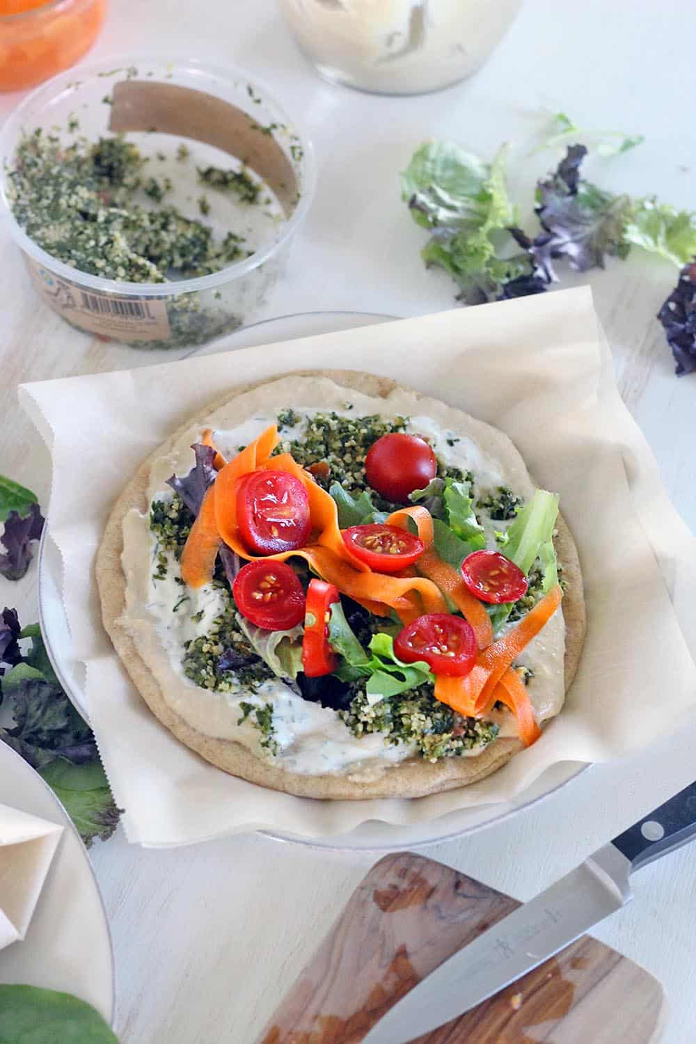 These are the ULTIMATE vegetarian pita sandwiches (vegan optional), piled high with hummus, tabbouleh, dill yogurt sauce, pickled veggies, greens, and tomatoes. Make in advance for lunch all week! #mealprep #vegetarian #sandwiches