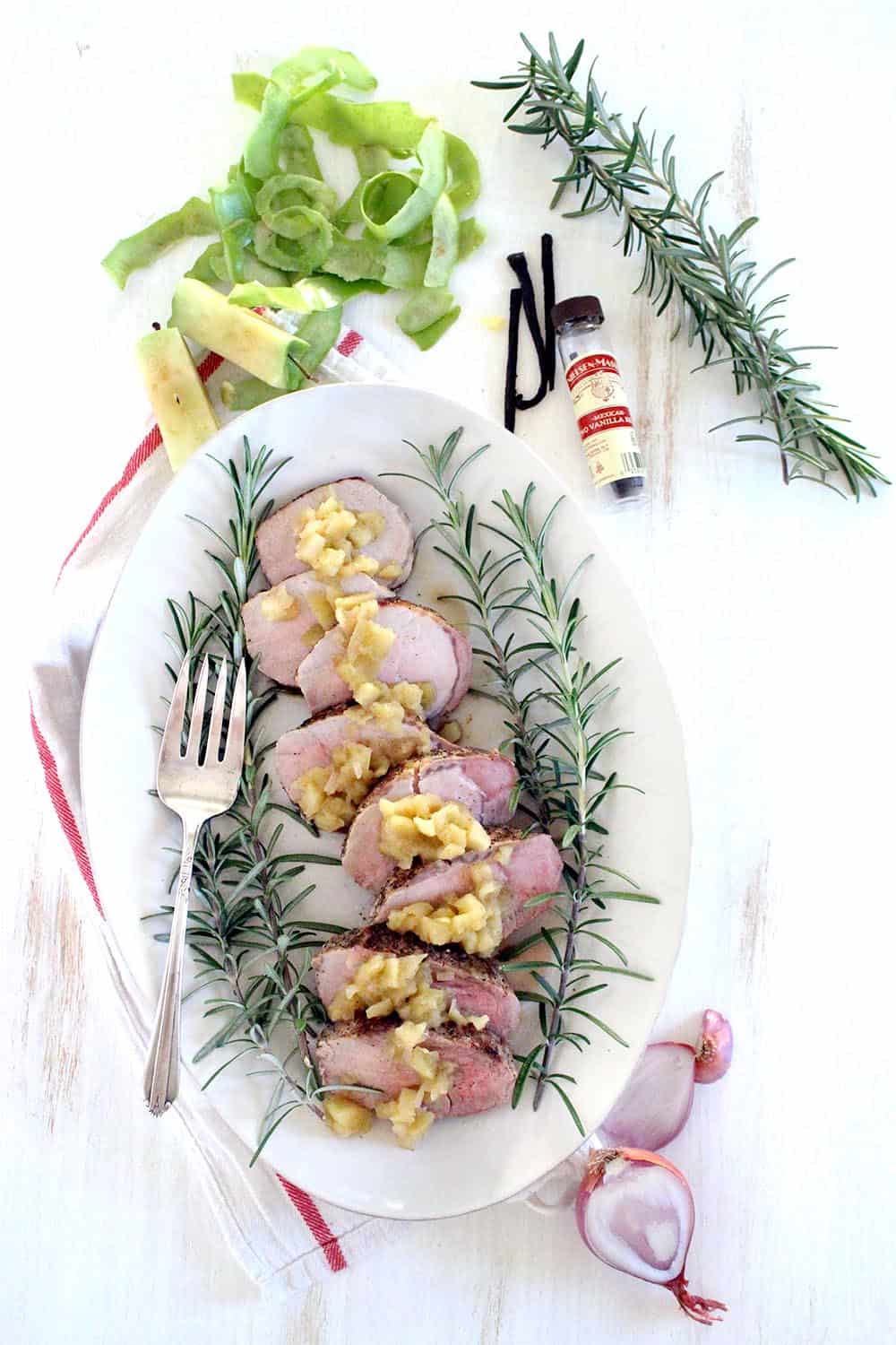 This Roast Pork Tenderloin with Vanilla Apple Chutney is an elegant yet simple, quick, and easy main dish that's perfect for your holiday feast or a weeknight dinner! The pork is juicy and the apple chutney, made with vanilla bean, is tart, slightly sweet, and earthy. #PorkTenderloin #AppleChutney #Paleo