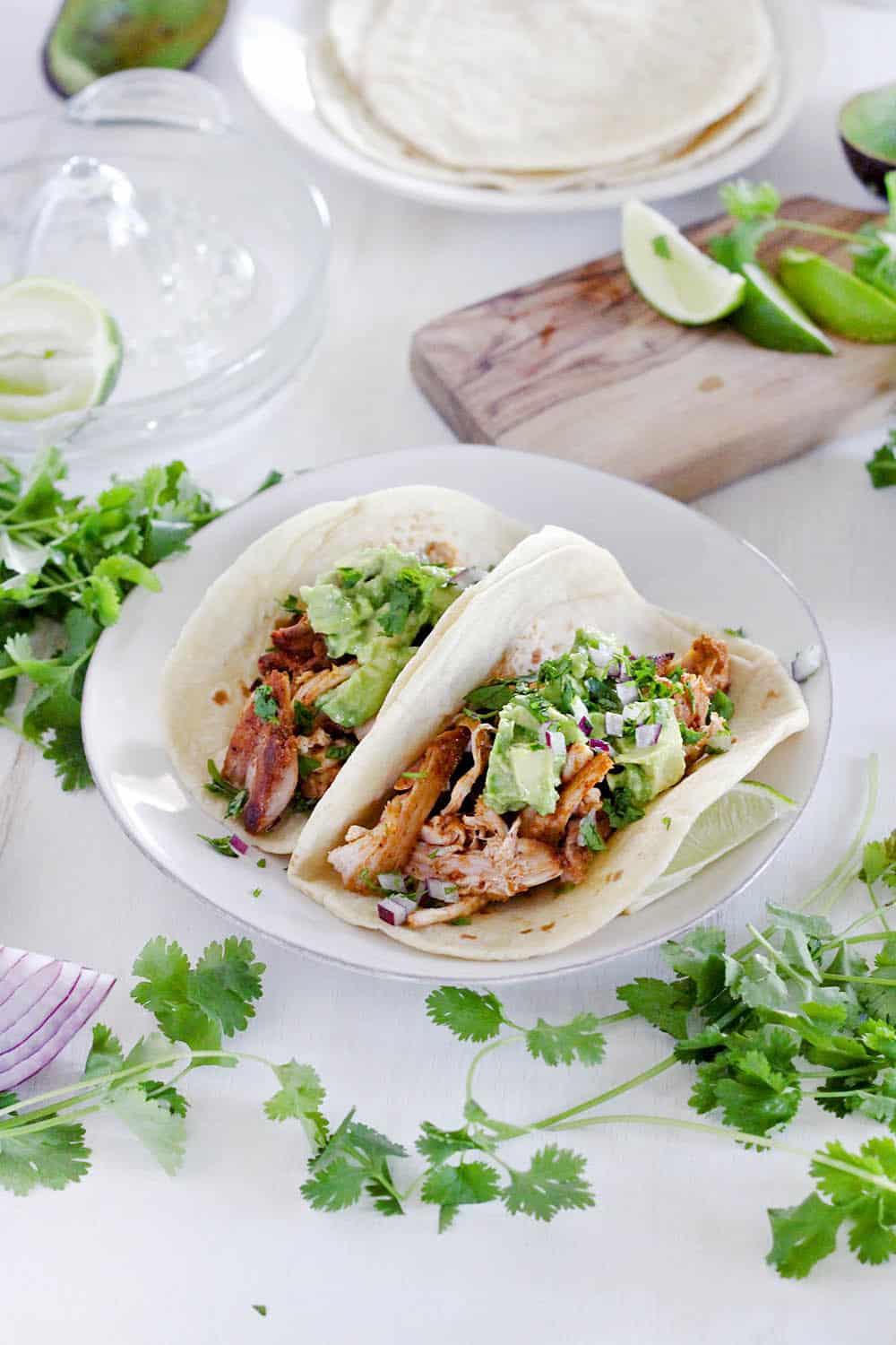 These smoky chicken and avocado tacos come together in only 20 minutes! They'll be your new favorite easy weeknight recipe for taco night and the whole family will love them. #TacoTuesday #MexicanFood