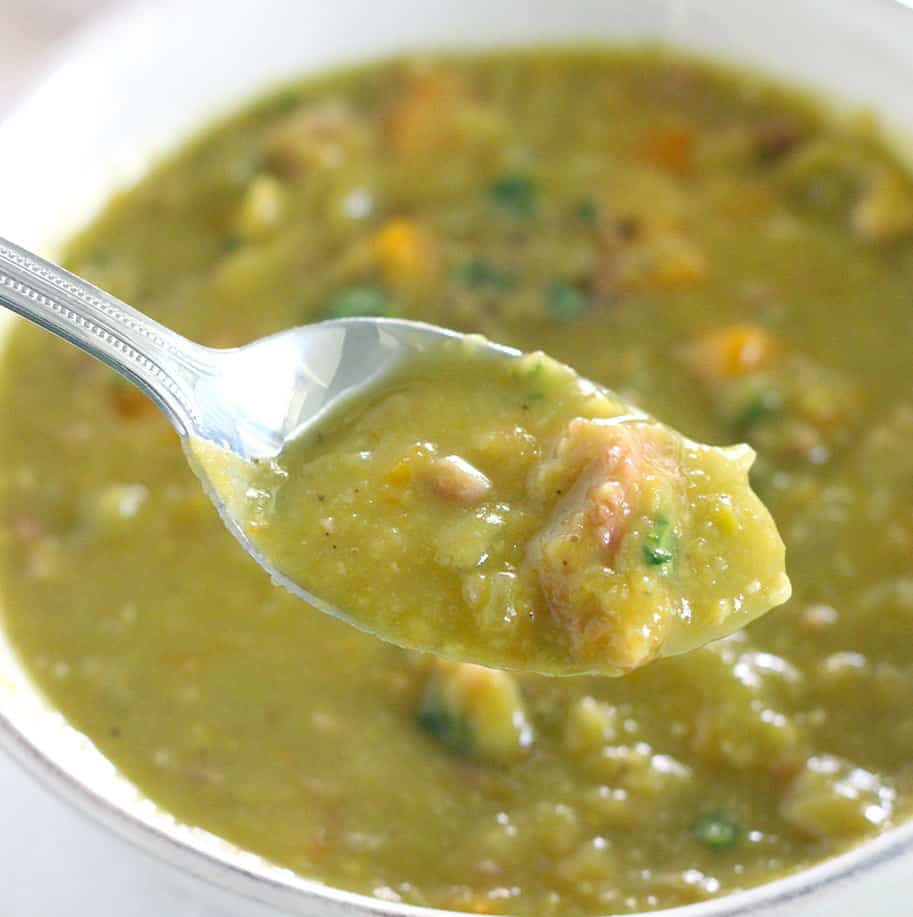 A spoonful of split pea soup with ham