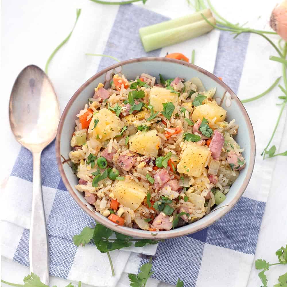 This Pineapple and Ham Fried Rice is a great recipe to use up leftover holiday ham! It only takes 15 minutes, one-pot, and it's easily made gluten-free. #FriedRice #LeftoverHamRecipes #Pineapple #QuickandEasy #15MinuteMeals #GlutenFree
